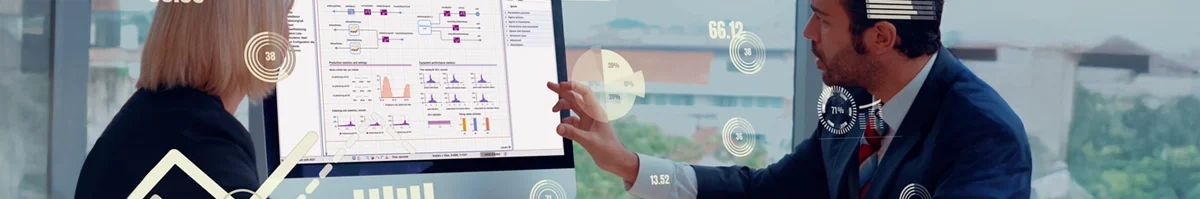 A man and a woman studying a simulation model on the screen